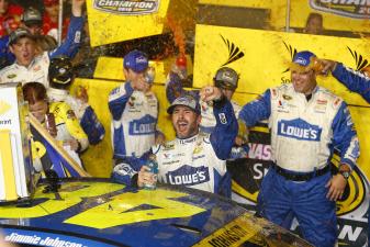 jimmie johnson celebrates a win