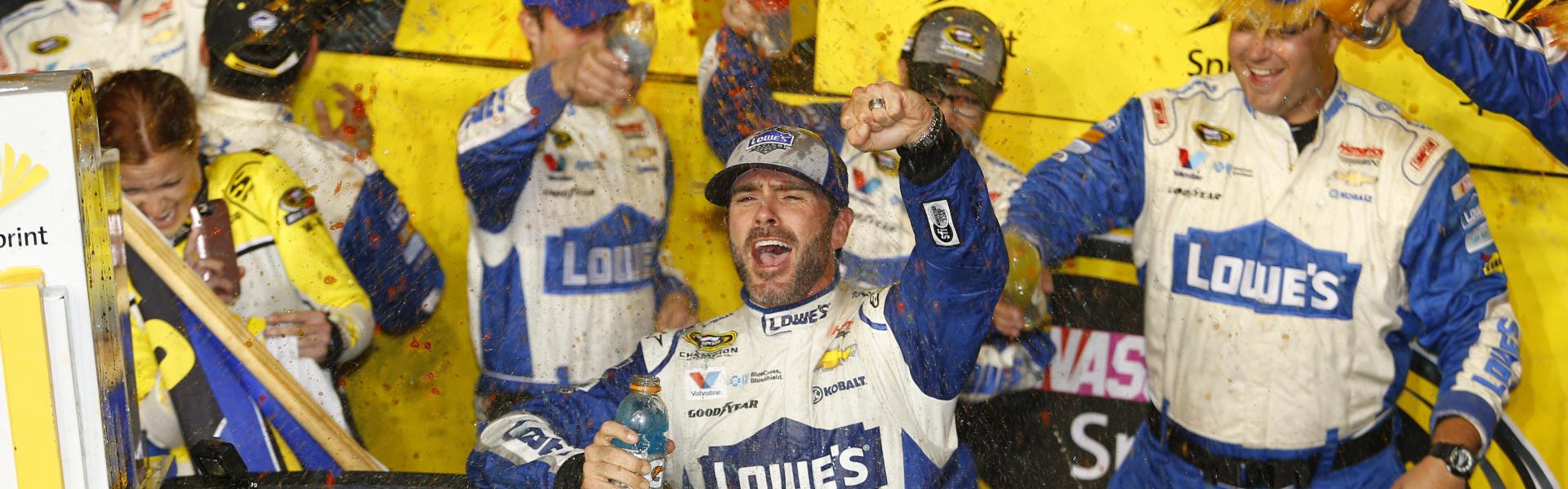 jimmie johnson celebrates a win